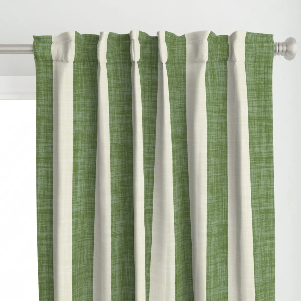 A curtain with a bold green cabana stripe design