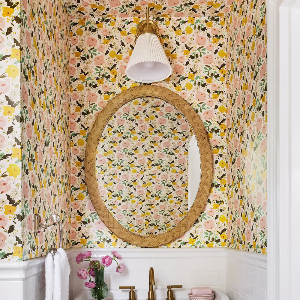 Bathroom with yellow rose floral wallpaper.