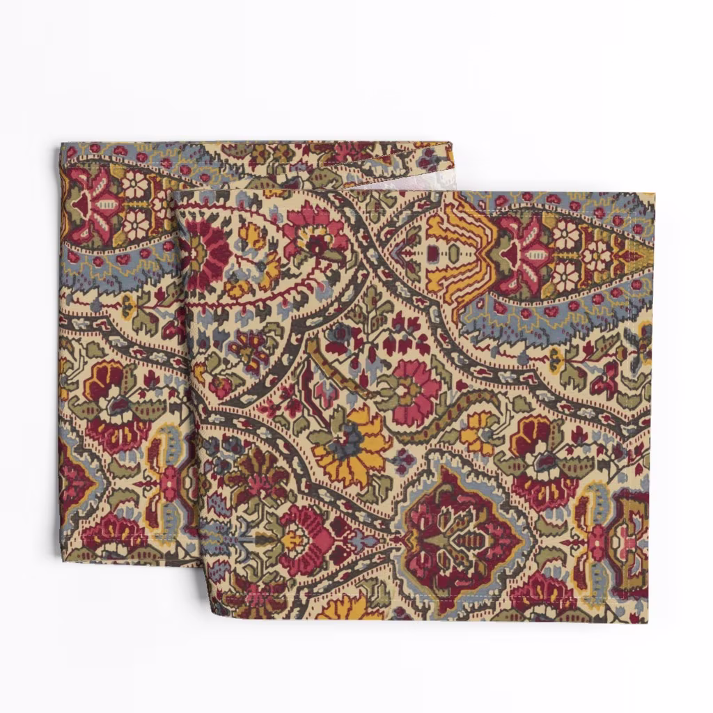 A traditional red paisley floral striped table runner