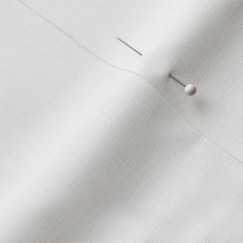Petal Signature Cotton fabric with a seam and a pin through 