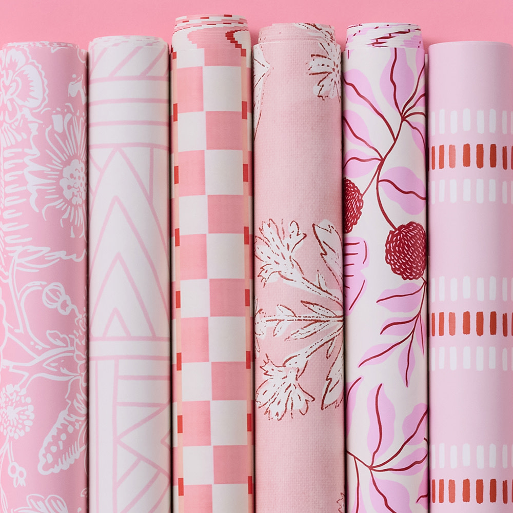 Rolls of pink wallpaper.