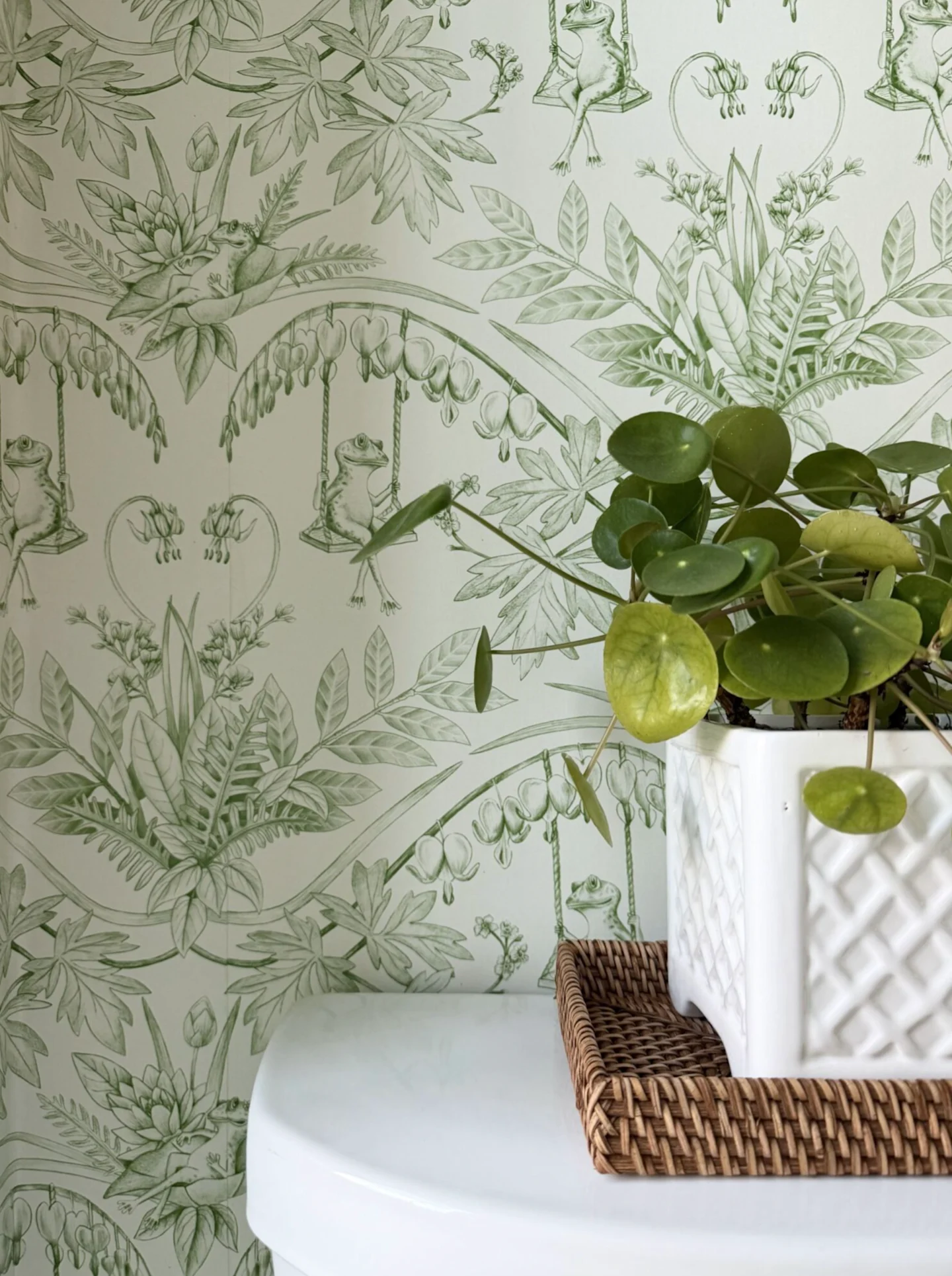 green patterned wallpaper in bathroom
