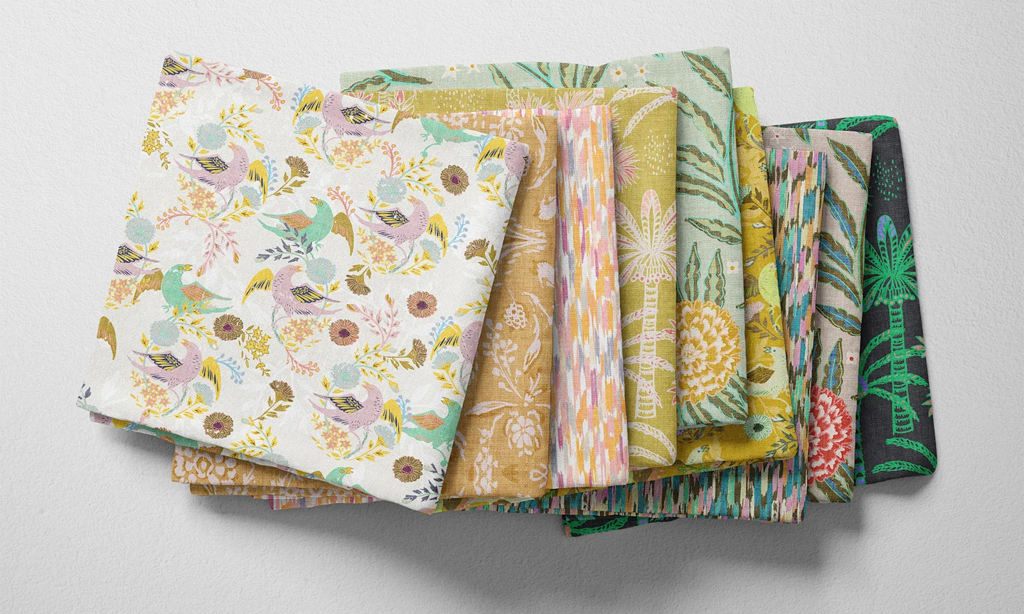 A selection of folded fabric fat quarters