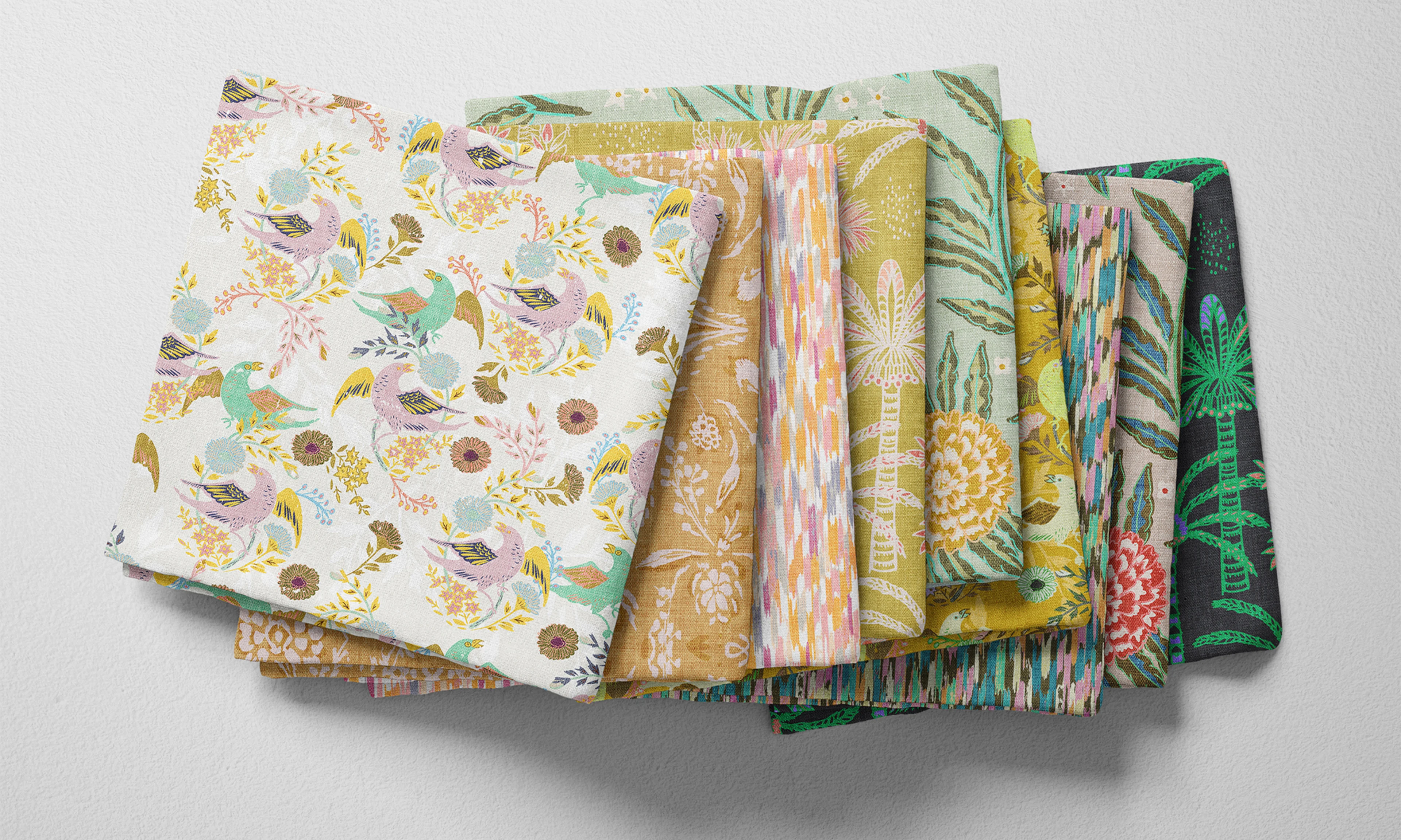 A selection of folded fabric fat quarters