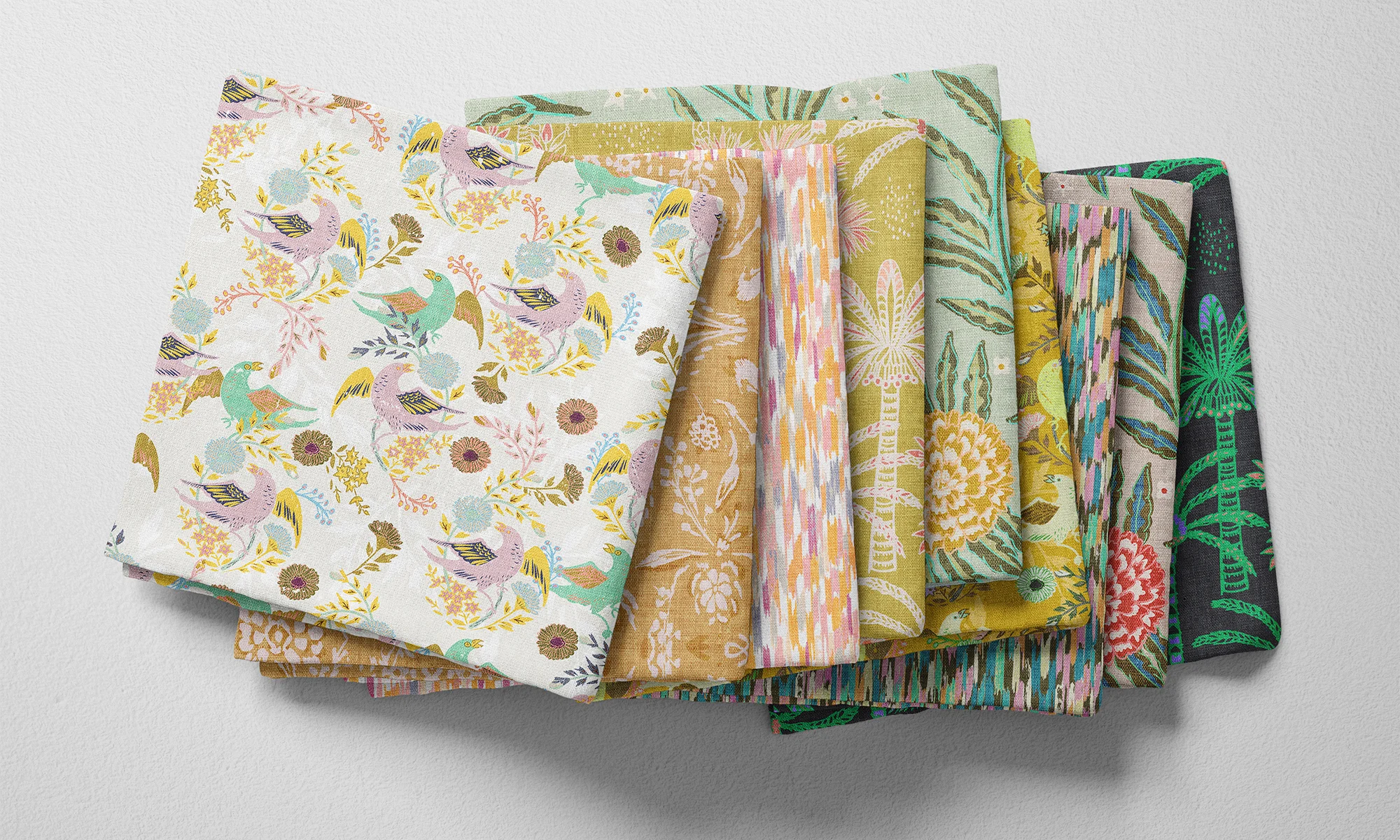 A selection of folded fabric fat quarters
