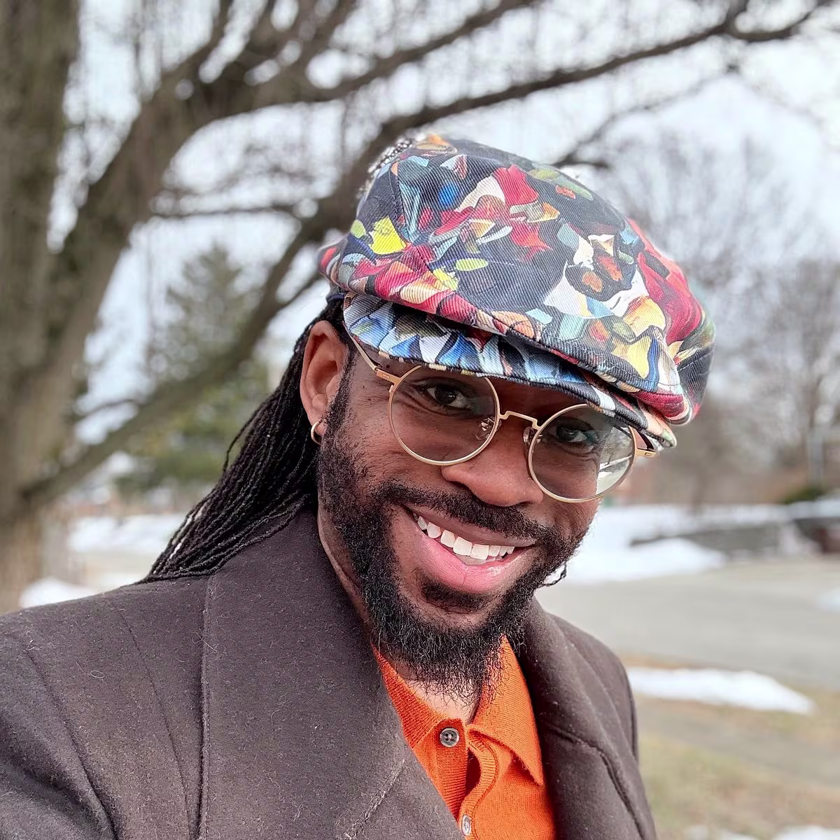 Julian Collins in his colorful handmade hat
