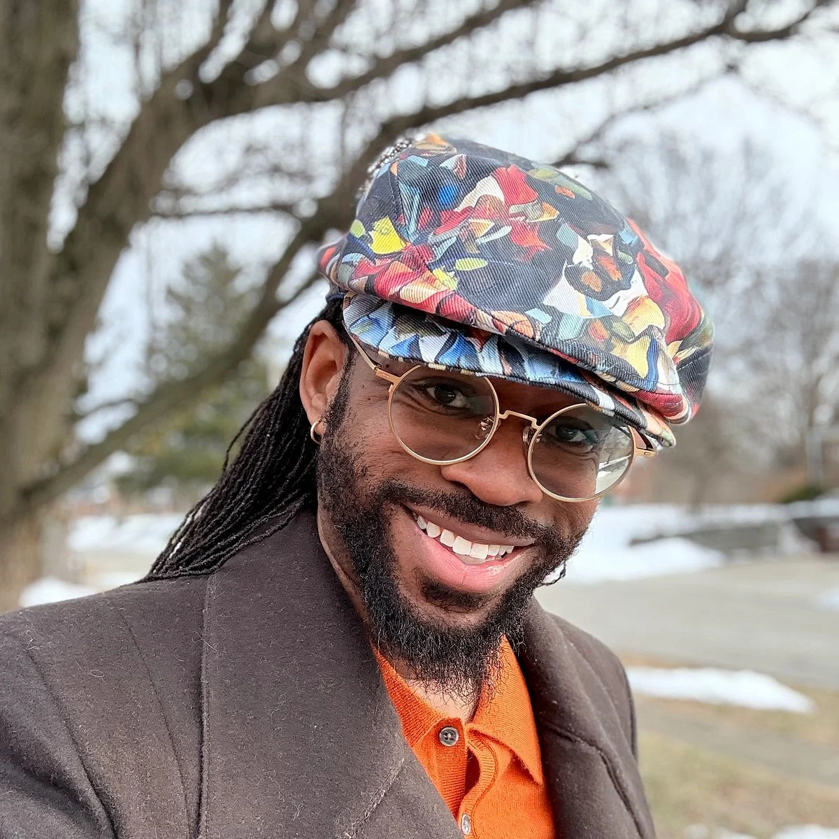 Julian Collins in his colorful handmade hat