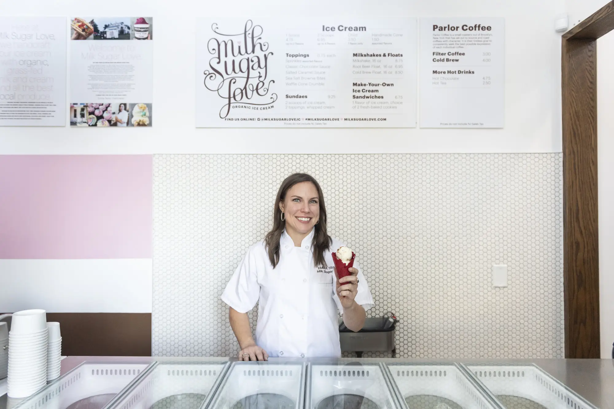 a woman standing with an ice cream cone.