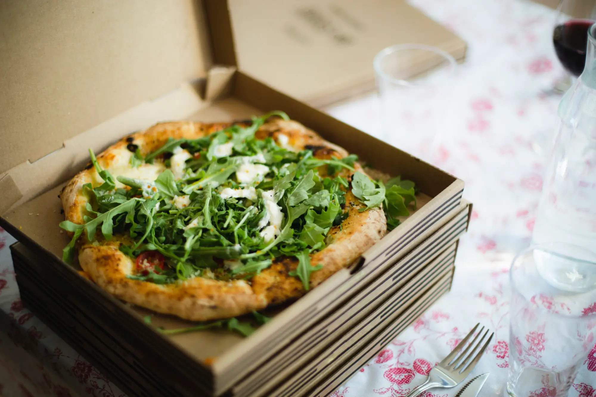 a box of pizza sitting on top of a table