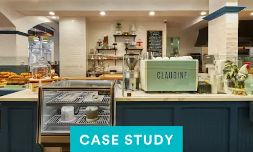 a kitchen that has a sign on a counter