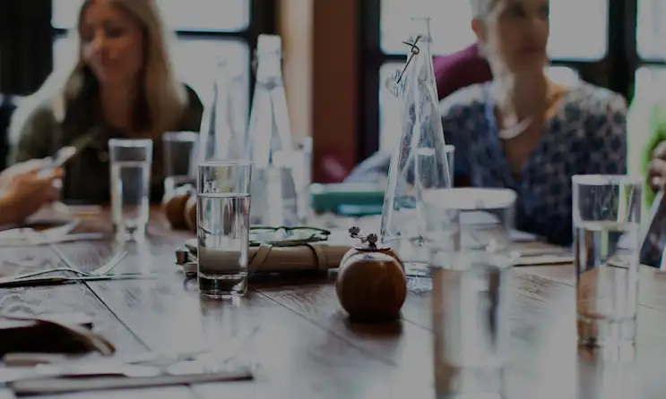 a group of people sitting at a table