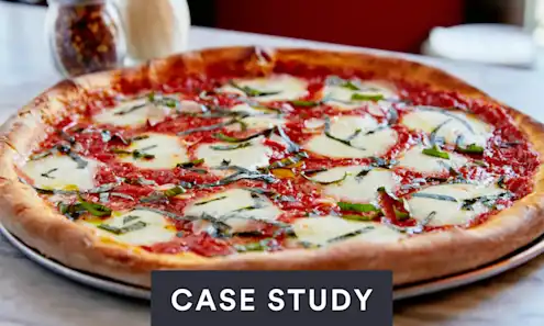 a pizza sitting on top of a wooden table