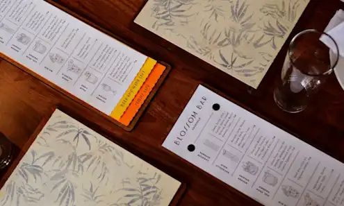 a stack of flyers on a table