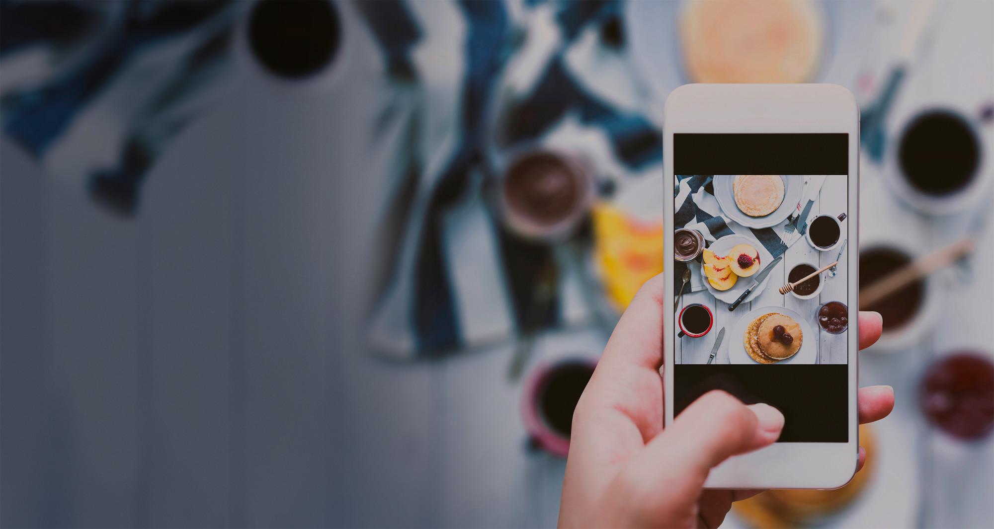 a hand holding a mobile phone