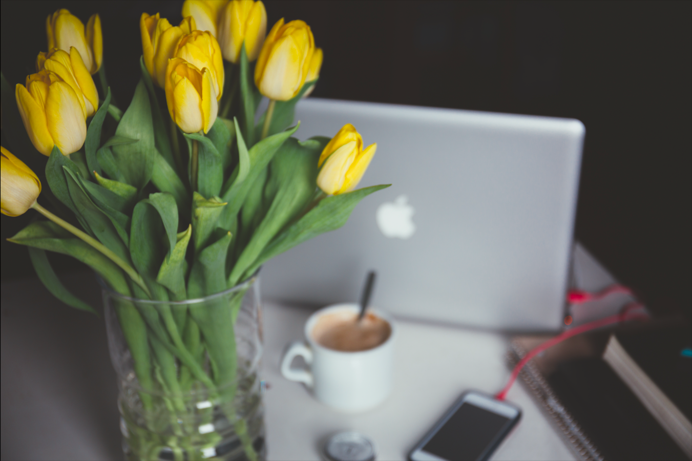 a vase filled with flowers sitting on a table