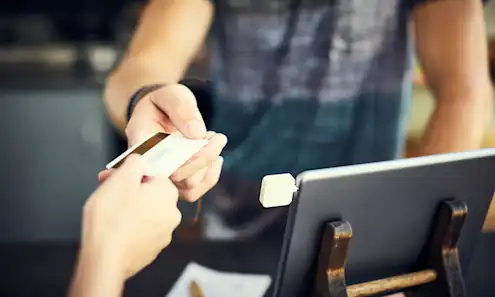 a hand holding a cell phone