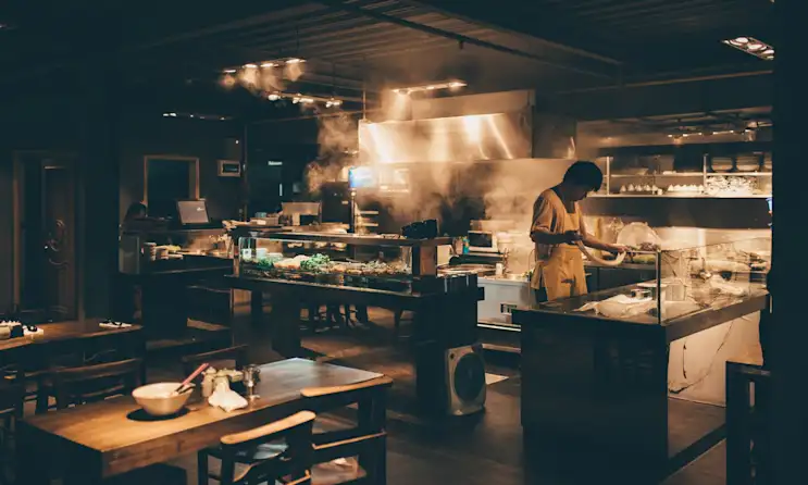 a person cooking in a kitchen