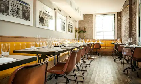 a dining room table in front of a window