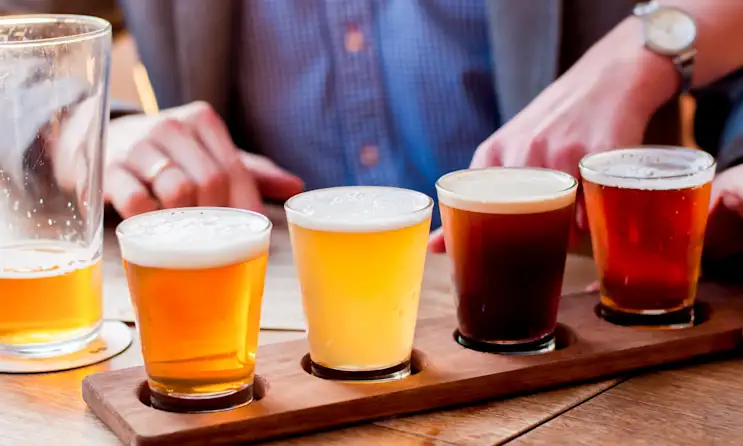 Flight of beers on a wooden board