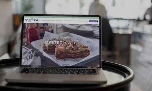 a laptop computer sitting on top of a table
