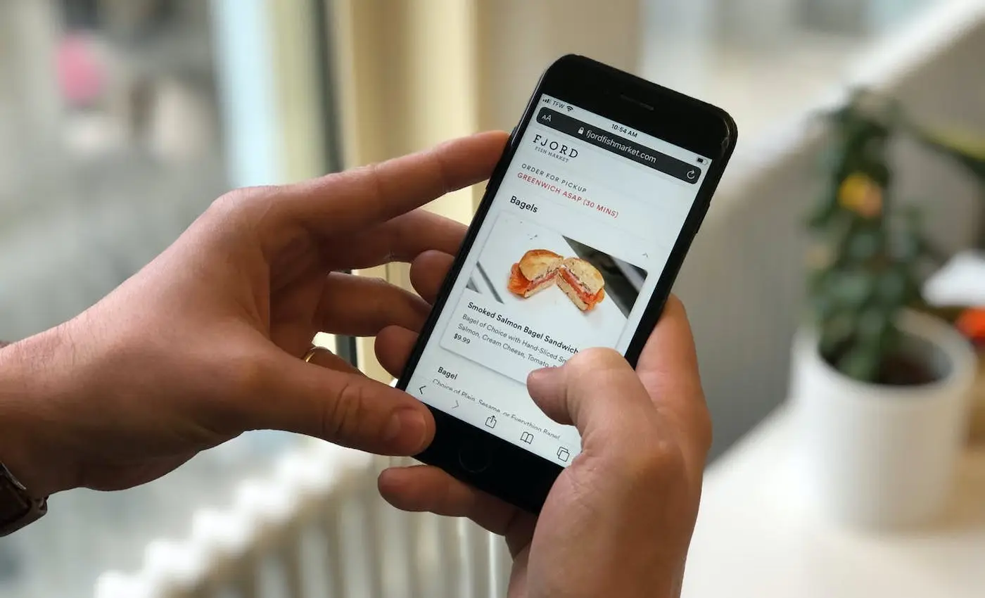 A person looking at online ordering on a mobile device