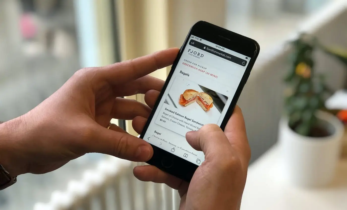 A person browsing online ordering on their mobile device