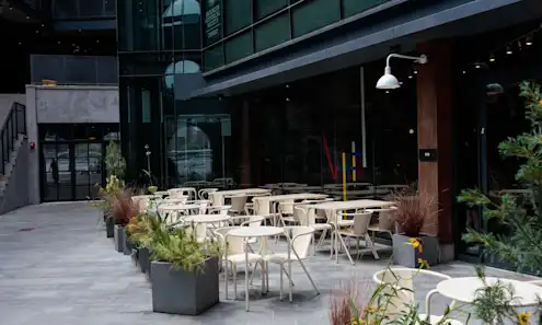 a chair sitting in front of a building