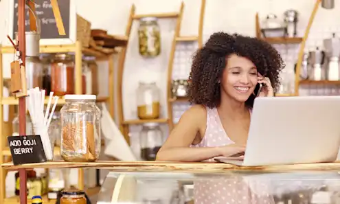 a woman sitting at a table in a restaurant