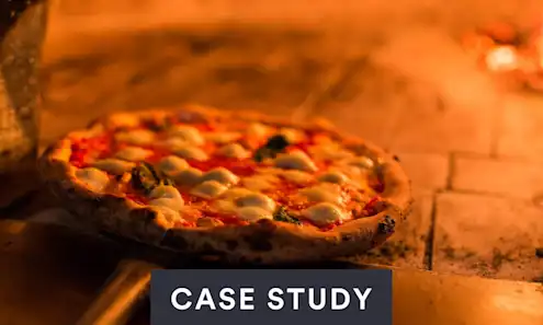 a slice of pizza sitting on top of a wooden table