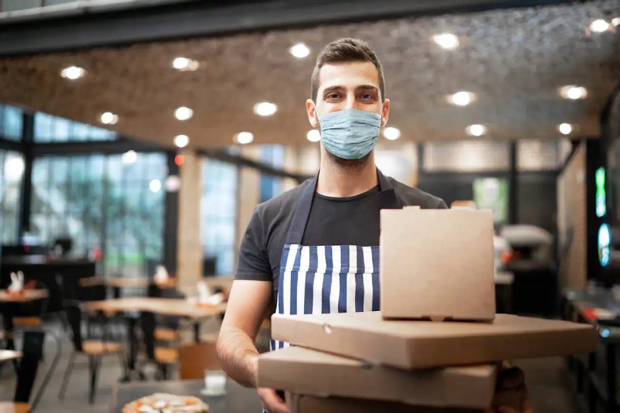 Front of house restaurant staff with to-go orders