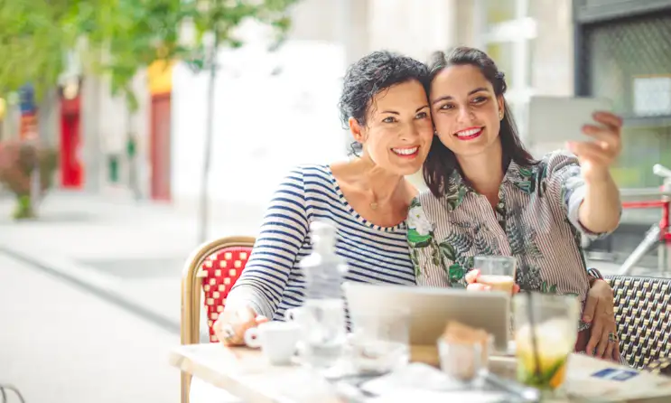 A mother and daughter sitting at a table
