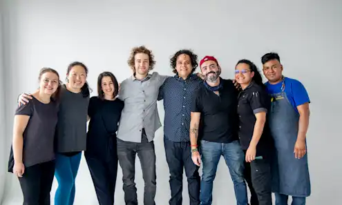 a group of people posing for the camera