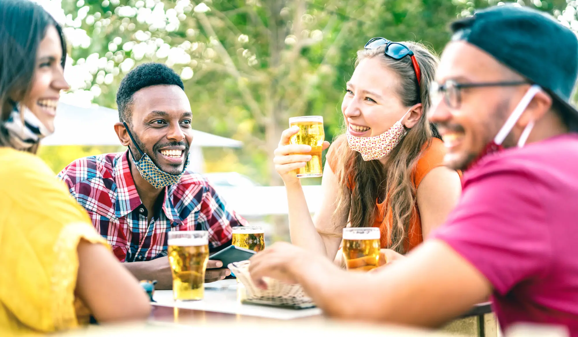 Guests safely enjoy a few drinks outside of a brewery