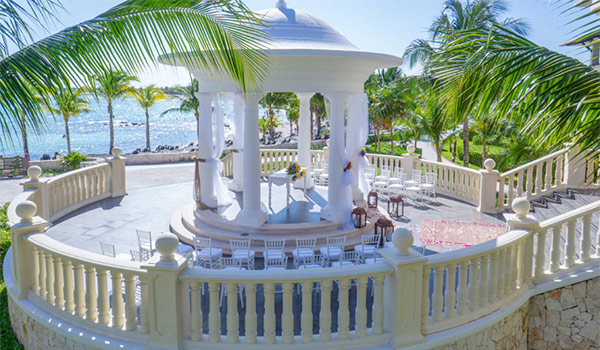 Wedding gazebo in the middle of a lush garden