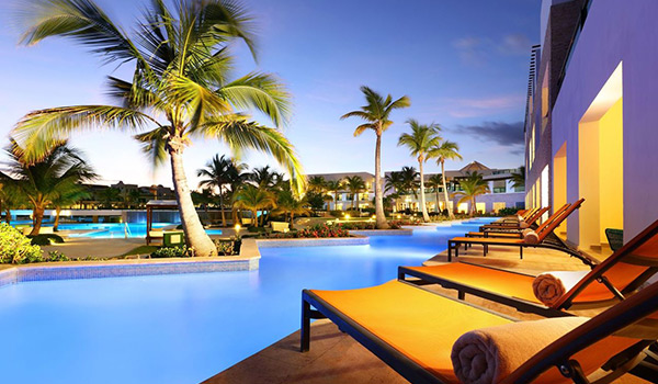 Loungers overlooking the pool at dusk