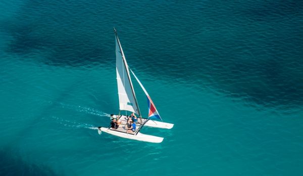Aerial view of people sailing on a catamaran