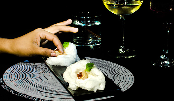 Person eating finger-food in a contemporary restaurant