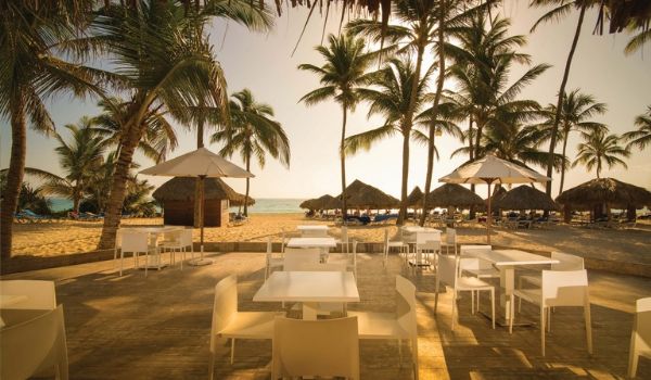Beach bar overlooking ocean at sunset