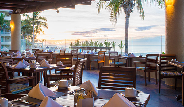 Restaurant by the ocean at sunset