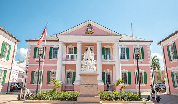 Pink colonial building with statue out front