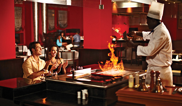 Couple watching a chef grill Teppanyaki style