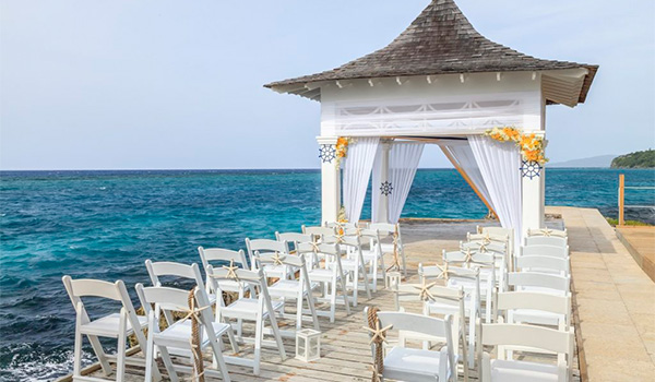 Wedding ceremony on a dock overlooking the ocean