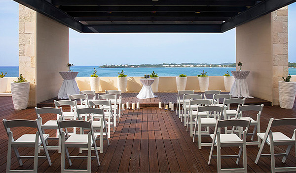 Wedding ceremony on a rooftop terrace overlooking the ocean
