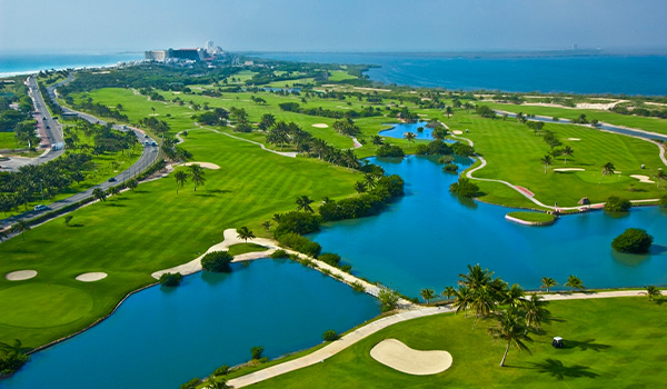 Aerial view of a golf course surrounding a lake