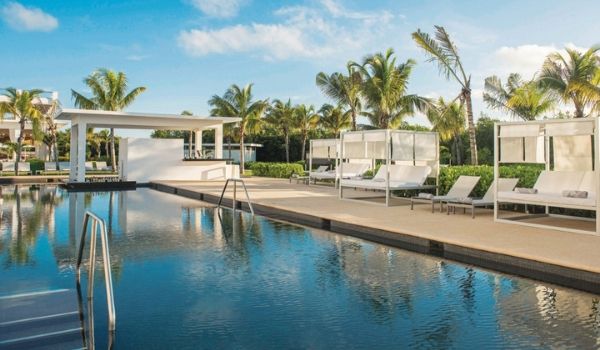 Relaxing-looking sun loungers by a serene pool