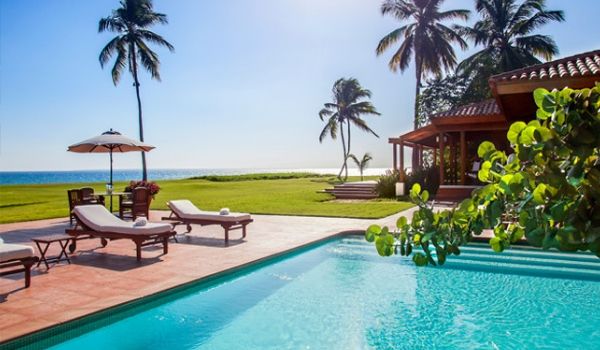 Sun loungers by sparkling pool
