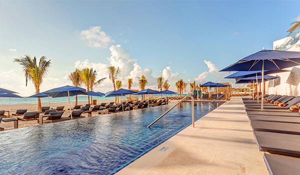 Infinity pool overlooking White-sand beach