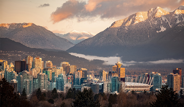 City skyline of Vancouver with mountains in the background