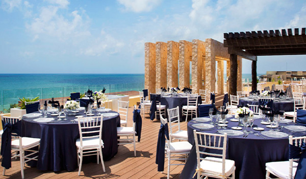 Wedding reception on a rooftop terrace overlooking the ocean