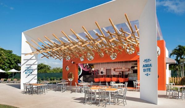 Outdoor restaurant surrounded by tables and chairs on a patio